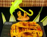 A picture of step 4 of Butter Garlicky Spicy Grilled Crispy Curly Corn Ribs - With Schezwan Dip Corn Ribs Monsoon Munching.