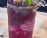 A picture of step 3 of Blue pea magic layered mocktail.