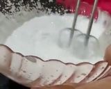 A picture of step 2 of 3 layered Cadbury and kiwi grapes Cheese cake 2 in 1.
