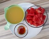 A picture of step 1 of Orange and Watermelon juice.