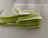 A picture of step 1 of Celery with Avocado and Green Onion.