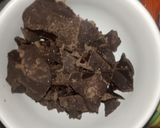 A picture of step 1 of 1 bite chocolatey marshmallow pops.