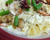 A picture of step 9 of Shrimp and bacon cheesy Alfredo.