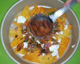 A picture of step 5 of Loaded Cheesy nachos.