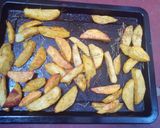 A picture of step 5 of Rosemary baked potato wedges.