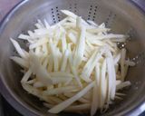 A picture of step 1 of Chilli potato fries.