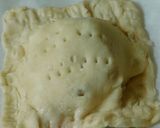 A picture of step 7 of Sweet apple samosa turn over.