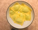 A picture of step 14 of Cheats Pea and Ricotta Ravioli with Rich Tomato Sauce.