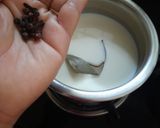 A picture of step 2 of Penne Pasta in cheesy oats white sauce.