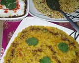 A picture of step 5 of Daliya khichdi with curd,papad and chutney.