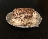 A picture of step 13 of Mocha Chip Ice Cream Sandwich Layer Cake.