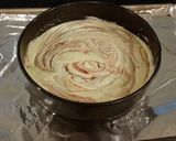 A picture of step 9 of White Layer Cake with a Raspberry Swirl Cheesecake center layer and a Raspberry Cream Frosting.