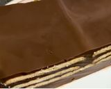 Foto langkah ke 5 dari resep Puding Coklat lapis Biskuit.
