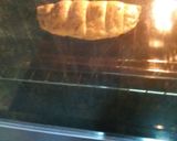 A picture of step 7 of Domino's style stuffed cheese garlic bread.