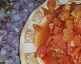 A picture of step 4 of Dam allu with colourful zeera rice.