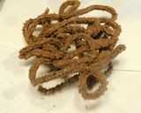 A picture of step 4 of Ragi murukku with onion garlic flavor.