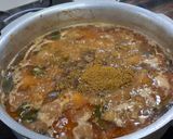 A picture of step 8 of Bhopali Red Rice Chicken Biryani.