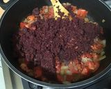 Une image de l'étape 12 de Dahl de lentilles jaunes aux carottes violettes, tomates et courgette.