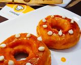 A picture of step 10 of Orange Glaze doughnut.