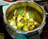 A picture of step 1 of Baingan Vatana Curry.