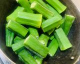 A picture of step 1 of Dahi Vendi (Okra in curd).