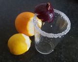 A picture of step 1 of Plum, grape and citrus rind juice.
