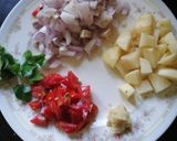 A picture of step 1 of -potato and chickpea roast.