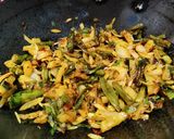 A picture of step 5 of Runner beans and potato fry with onion and onion greens.