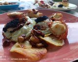 Foto del paso 9 de la receta: Langosta al ajillo con huevos fritos y patatas panadera