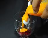 A picture of step 1 of Devil's Knight Layered Mocktail.