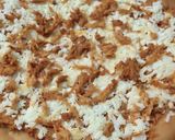 A picture of step 6 of Tandoori chicken pizza on stove.