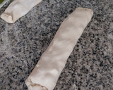 Foto del paso 8 de la receta: Rulo de pizza de jamón, quesos y olivas
