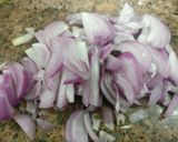 A picture of step 3 of Aachari karela.