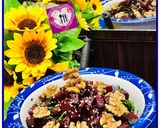 A picture of step 3 of Mediterranean beet salad with dash of roasted walnuts.