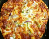 A picture of step 6 of Pizza with fresh pizza dough.