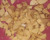 A picture of step 2 of French fries with chicken.