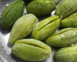 A picture of step 1 of Potoler dolma pointed gourd with spicy filling.