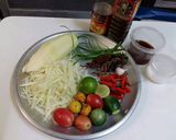 A picture of step 1 of Som Tum (Papaya Salad with Pickled Crab and Fermented Fish Sauce).