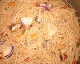 A picture of step 5 of Stir fried pasta with smoked fish.