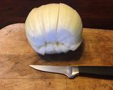 A picture of step 1 of California Farm Upside Down Blooming Onion.