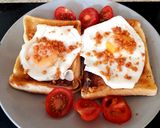 A picture of step 2 of My Simple Fried Egg on Toast with Bacon Crisps and Tomatoes. 😘.