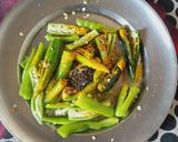 A picture of step 3 of Green chilli pickle.