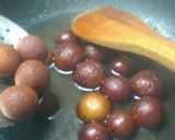 A picture of step 14 of Warm gulab jamun in sweet crunchy tacos.