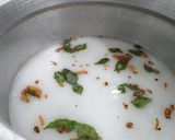 A picture of step 2 of Coconut Milk Garlic Rice.