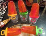 A picture of step 6 of Tangy Orange popsicles.