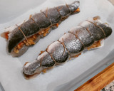 Foto del paso 7 de la receta: Lubina rellena de langostinos y panceta en salsa verde