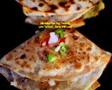 A picture of step 5 of Aloo Matar Tikki Paneer Schezwan Tortilla Quesadilla.