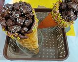A picture of step 5 of Chocolate Makhana Cone.