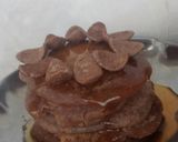 A picture of step 11 of Oven Mini pancakes with honey and choco on top.