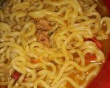 A picture of step 6 of Seafood indomie with fish chunks.